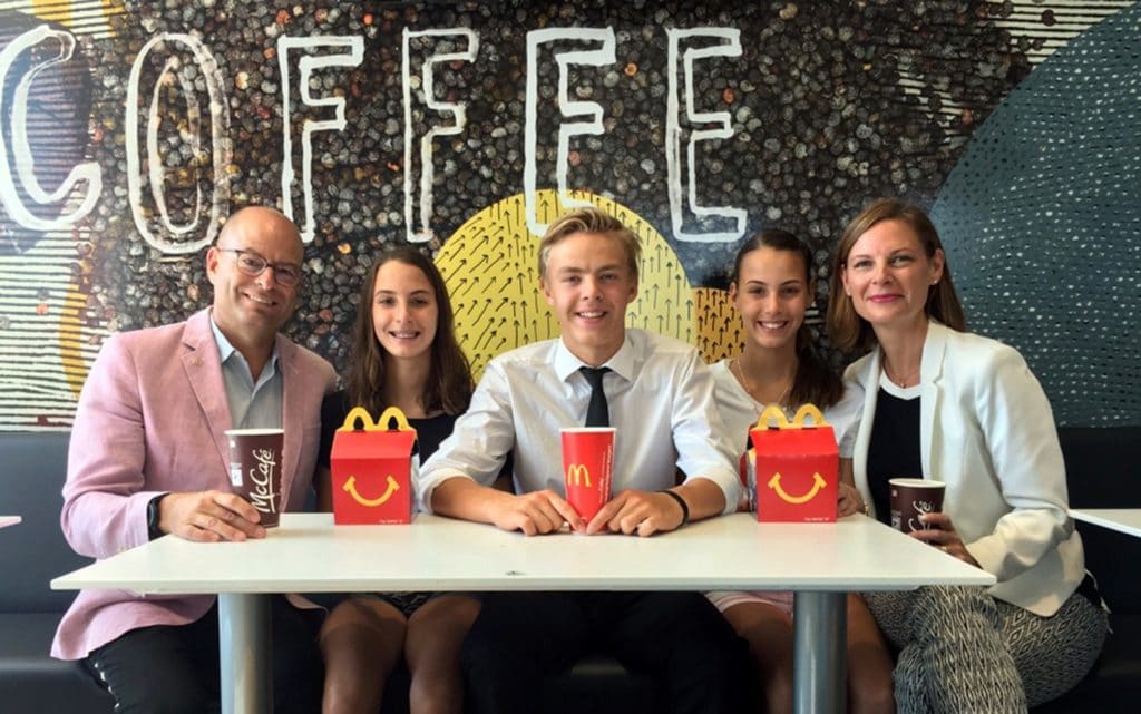 5 people sitting in McDonald's