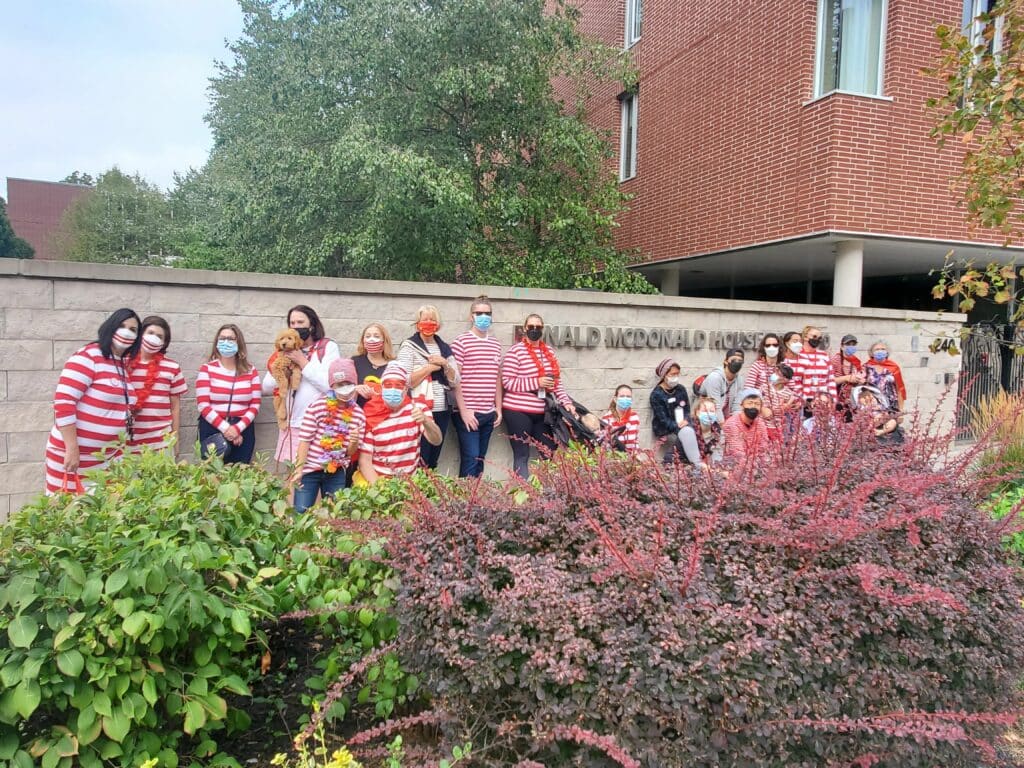 A group of people wearing stripes outside RMHC Toronto House